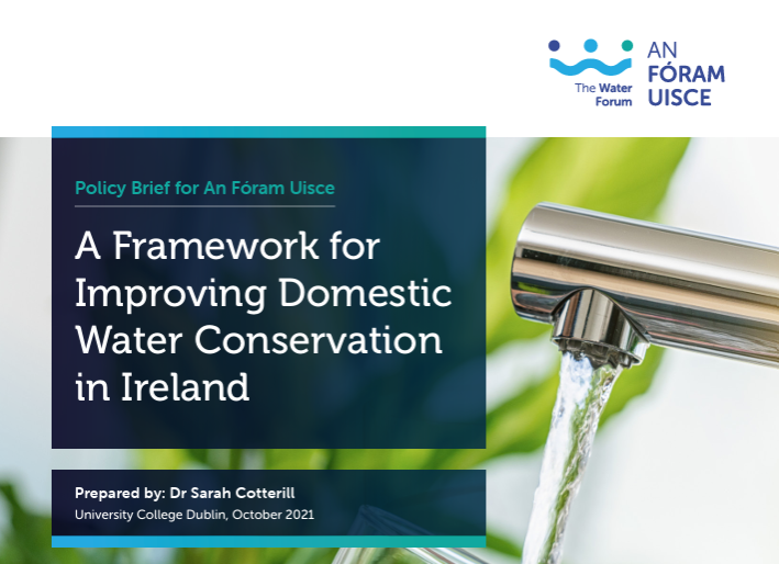 A hand holding a glass of water under a flowing tap